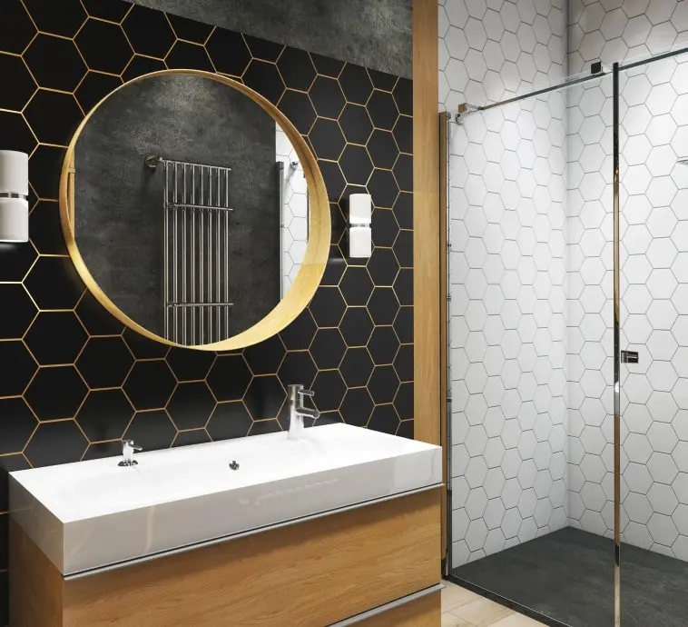 Modern bathroom with black and gold hexagon tile wall, wood vanity, and glass shower enclosure