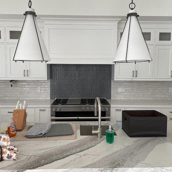 Modern kitchen backsplash with white cabinets and gray tile in Barrie, Ontario