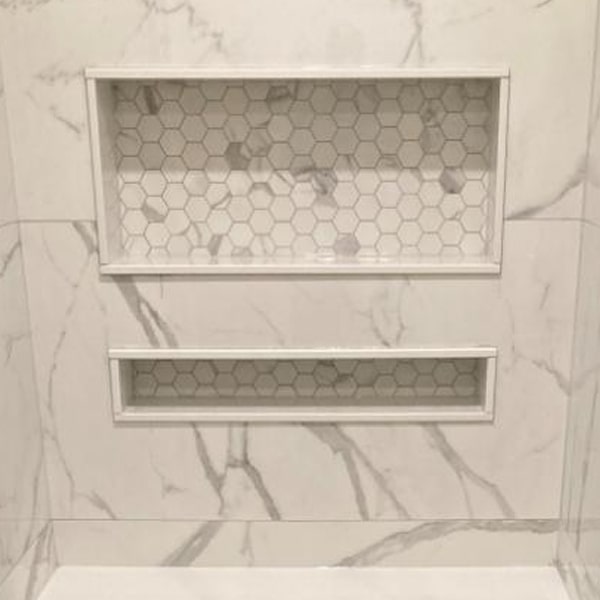 Custom backsplash installation in Muskoka home with elegant tile design